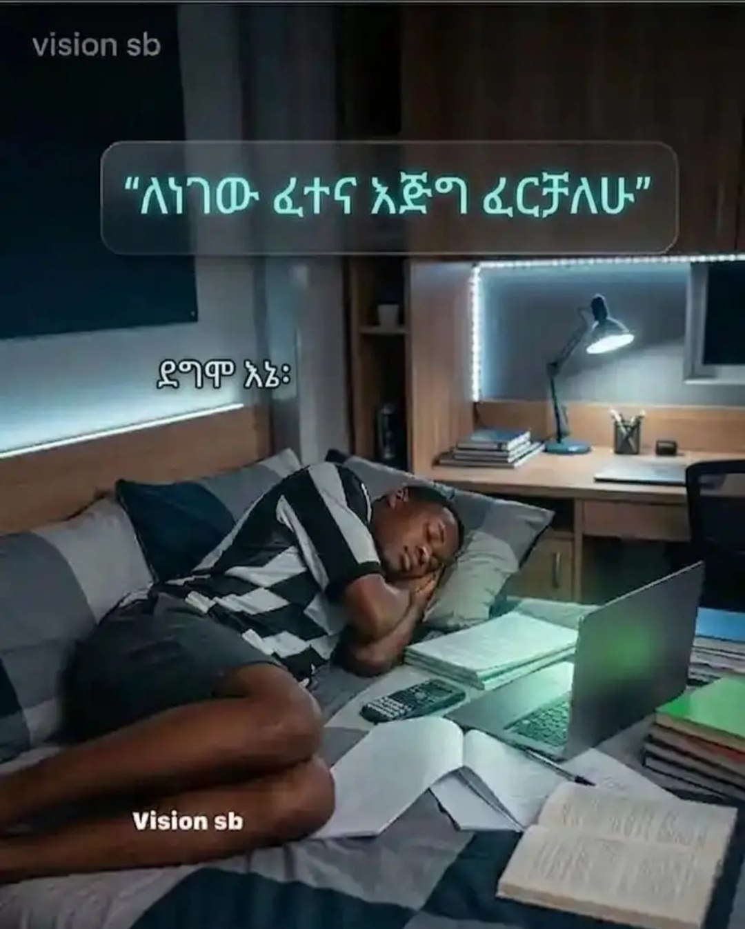 a man laying on a bed with a laptop